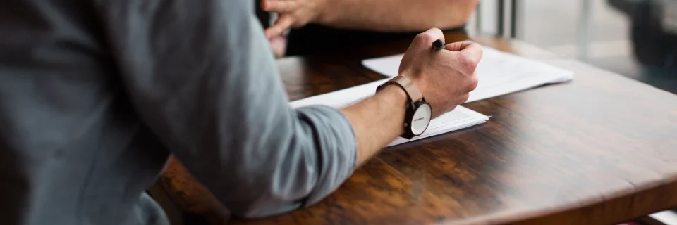 Offer page graphic (man with papers and pen)